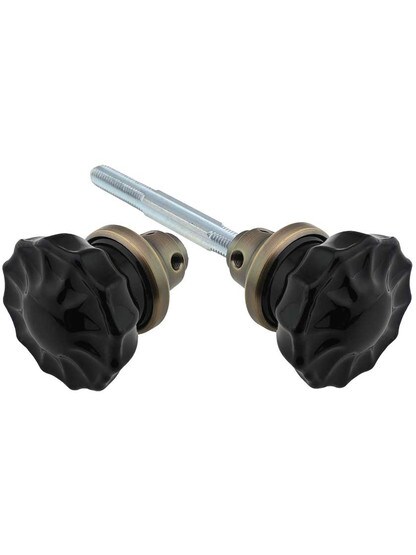 Pair of Black Fluted Crystal Glass Door Knobs in Antique Brass.